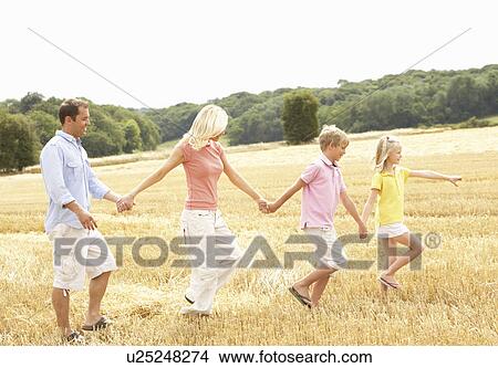 Family Walking Together Through Summer Harvested Field View Large Photo Image Picture - Family Walking Together Through Summer Harvested Field. Fotosearch