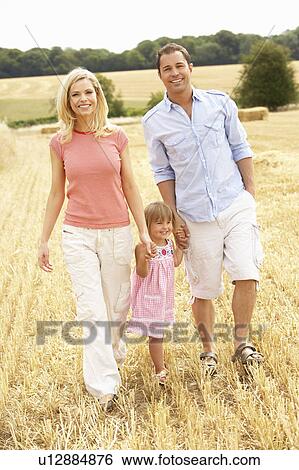 Family Walking Together Through Summer Harvested Field View Large Photo Image Stock Photograph - Family Walking Together Through Summer Harvested Field. Fotosearch