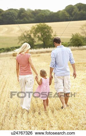 Family Walking Together Through Summer Harvested Field View Large Photo Image Stock Photograph - Family Walking Together Through Summer Harvested Field. Fotosearch