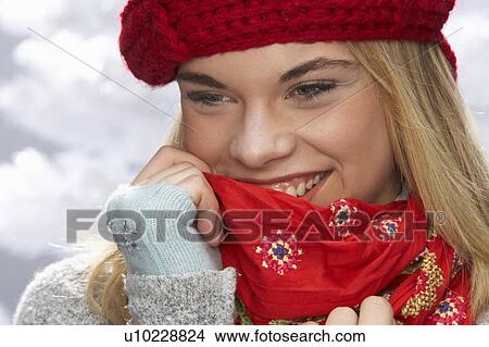 Fashionable Teenage Girl Wearing Cap And Knitwear In Studio In Front Of Christmas Tree View Large Photo Image Picture - Fashionable Teenage Girl Wearing Cap And Knitwear In Studio In Front Of Christmas Tree. Fotosearch