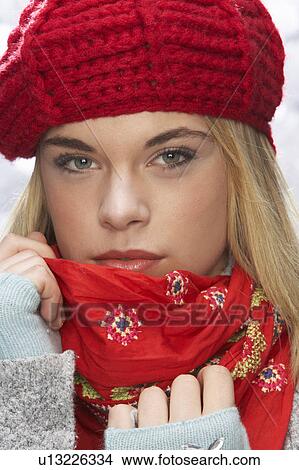 Fashionable Teenage Girl Wearing Cap And Knitwear In Studio In Front Of Christmas Tree View Large Photo Image Picture - Fashionable Teenage Girl Wearing Cap And Knitwear In Studio In Front Of Christmas Tree. Fotosearch