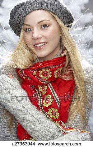 Fashionable Teenage Girl Wearing Cap And Knitwear In Studio In Front Of Christmas Tree View Large Photo Image Picture - Fashionable Teenage Girl Wearing Cap And Knitwear In Studio In Front Of Christmas Tree. Fotosearch