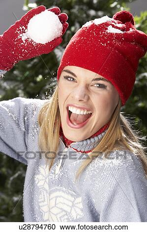 Fashionable Teenage Girl Wearing Cap And Knitwear Holding Snowball In Studio In Front Of Christmas Tree View Large Photo Image Stock Image - Fashionable Teenage Girl Wearing Cap And Knitwear Holding Snowball In Studio In Front Of Christmas Tree. Fotosearch