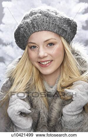 Fashionable Teenage Girl Wearing Cap And Fur Coat In Studio In Front Of Christmas Tree View Large Photo Image Stock Photo - Fashionable Teenage Girl Wearing Cap And Fur Coat In Studio In Front Of Christmas Tree. Fotosearch