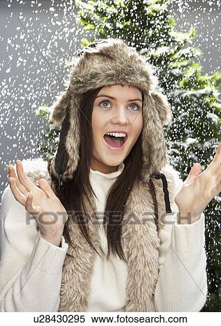 Fashionable Teenage Girl Wearing Cap And Knitwear In Studio In Front Of Christmas Tree View Large Photo Image Stock Photography - Fashionable Teenage Girl Wearing Cap And Knitwear In Studio In Front Of Christmas Tree. Fotosearch