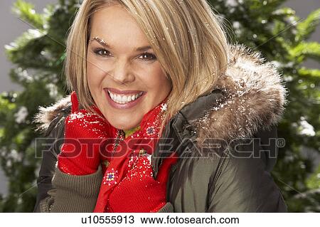 Fashionable Woman Wearing Parka Coat And Scarf In Studio In Front Of Christmas Tree View Large Photo Image Stock Image - Fashionable Woman Wearing Parka Coat And Scarf In Studio In Front Of Christmas Tree. Fotosearch