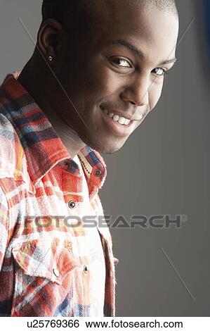 Fashionable Young Man Wearing Casual Clothes In Studio View Large Photo Image Stock Photograph - Fashionable Young Man Wearing Casual Clothes In Studio. Fotosearch