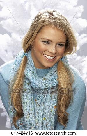 Stock Photograph - Fashionable Young Woman Wearing Knitwear In Studio. Fotosearch