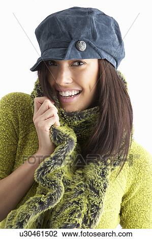 Fashionable Young WomanWearing Cap And Knitwear In Studio View Large Photo Image Stock Image - Fashionable Young WomanWearing Cap And Knitwear In Studio. Fotosearch