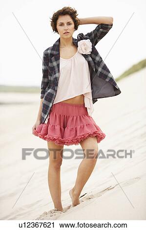 Fashionably Dressed Attractive Young Woman Standing Amongst Sand Dunes View Large Photo Image Stock Image - Fashionably Dressed Attractive Young Woman Standing Amongst Sand Dunes. Fotosearch