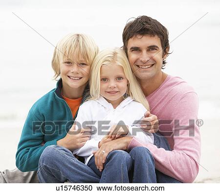 Father And Children Sitting On Winter Beach Together View Large Photo Image Stock Image - Father And Children Sitting On Winter Beach Together. Fotosearch