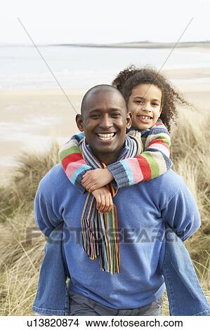 Father And Daughter Amongst Dunes On Winter Beach View Large Photo Image Picture - Father And Daughter Amongst Dunes On Winter Beach. Fotosearch