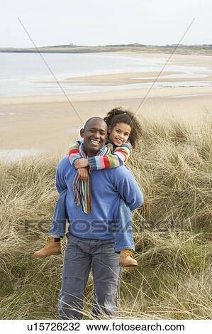 Father And Daughter Amongst Dunes On Winter Beach View Large Photo Image Stock Image - Father And Daughter Amongst Dunes On Winter Beach. Fotosearch