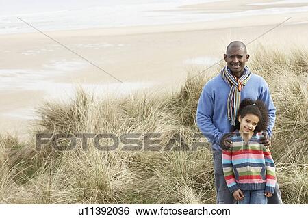 Father And Daughter Amongst Dunes On Winter Beach View Large Photo Image Stock Photograph - Father And Daughter Amongst Dunes On Winter Beach. Fotosearch