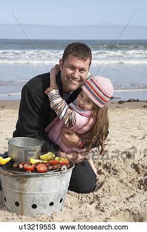 Father And Daughter Having Barbeque On Winter Beach View Large Photo Image Stock Image - Father And Daughter Having Barbeque On Winter Beach. Fotosearch