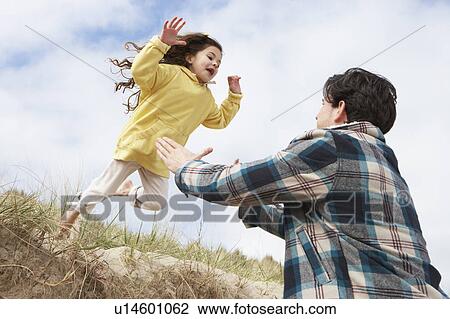 Father And Daughter Having Fun On Beach Together View Large Photo Image Stock Image - Father And Daughter Having Fun On Beach Together. Fotosearch