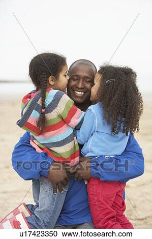 Father And Daughters Relaxing On Winter Beach Break View Large Photo Image Stock Image - Father And Daughters Relaxing On Winter Beach Break . Fotosearch