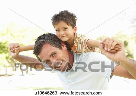 Father Giving Son Ride On Back In Park View Large Photo Image Stock Image - Father Giving Son Ride On Back In Park. Fotosearch