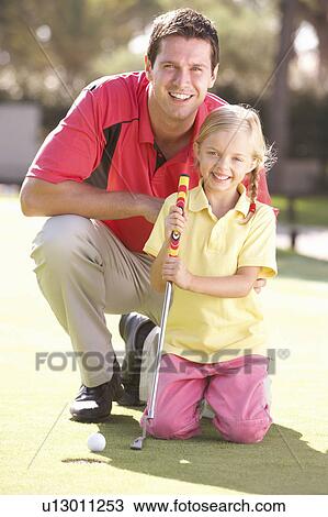 Father Teaching Daughter To Play Golf On Putting On Green View Large Photo Image Stock Image - Father Teaching Daughter To Play Golf On Putting On Green. Fotosearch