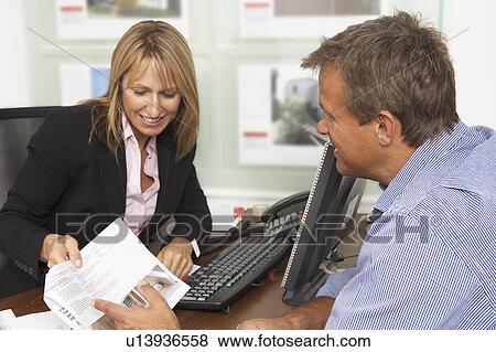 Female Estate Discussing Property Details With Client View Large Photo Image Stock Photo - Female Estate Discussing Property Details With Client. Fotosearch