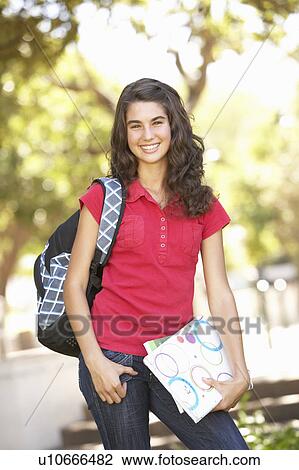 Stock Image - Female Teenage Student In Park. Fotosearch