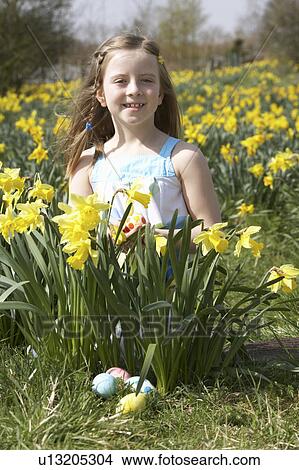 Girl On Easter Egg Hunt In Daffodil Field View Large Photo Image Picture - Girl On Easter Egg Hunt In Daffodil Field. Fotosearch