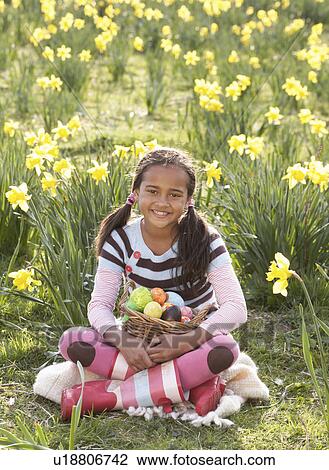 Girl On Easter Egg Hunt In Daffodil Field View Large Photo Image Stock Image - Girl On Easter Egg Hunt In Daffodil Field. Fotosearch