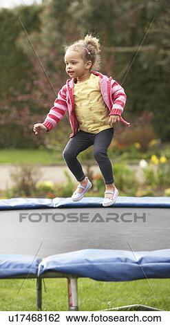Girl Playing On Trampoline View Large Photo Image Stock Image - Girl Playing On Trampoline. Fotosearch