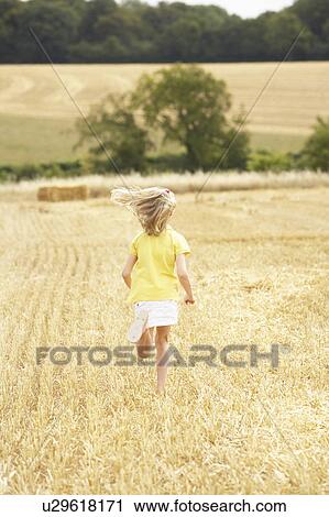 Girl Running Through Summer Harvested Field View Large Photo Image Stock Image - Girl Running Through Summer Harvested Field. Fotosearch