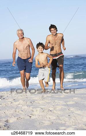 Grandfather, Father and Grandson Running Along Beach View Large Photo Image Stock Photo - Grandfather, Father and Grandson Running Along Beach. Fotosearch