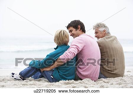 Grandfather, Father And Grandson Sitting On Winter Beach View Large Photo Image Stock Photography - Grandfather, Father And Grandson Sitting On Winter Beach. Fotosearch