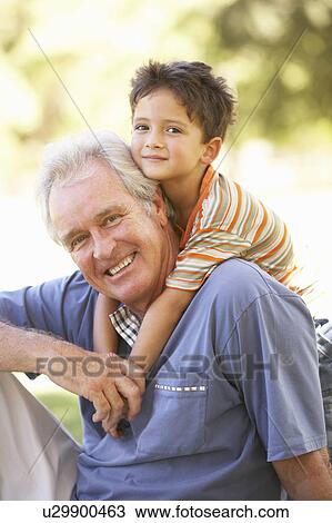 Grandfather Giving Grandson Ride On Back In Park View Large Photo Image Stock Image - Grandfather Giving Grandson Ride On Back In Park. Fotosearch