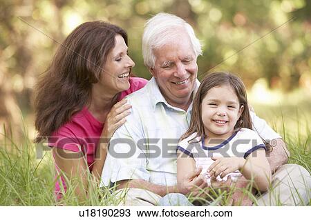 Grandfather With Daughter And Granddaughter In Park View Large Photo Image Stock Image - Grandfather With Daughter And Granddaughter In Park. Fotosearch