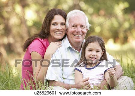 Grandfather With Daughter And Granddaughter In Park View Large Photo Image Stock Image - Grandfather With Daughter And Granddaughter In Park. Fotosearch