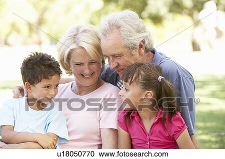 Grandparents And Grandchildren Enjoying Day In Park View Large Photo Image Stock Image - Grandparents And Grandchildren Enjoying Day In Park. Fotosearch
