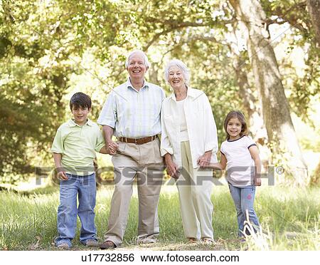 Grandparents In Park With Grandchildren View Large Photo Image Stock Photograph - Grandparents In Park With Grandchildren. Fotosearch