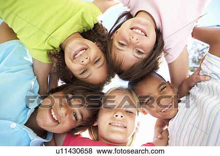 Stock Photo - Group Of Children Looking Down Into Camera. Fotosearch