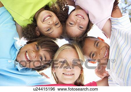 Stock Photograph - Group Of Children Looking Down Into Camera. Fotosearch