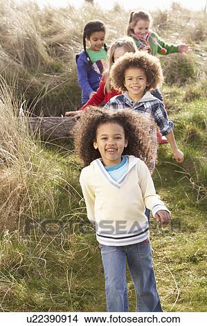 Group Of Children Playing In Field Together View Large Photo Image Picture - Group Of Children Playing In Field Together. Fotosearch