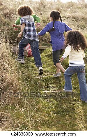 Group Of Children Playing In Field Together View Large Photo Image Stock Image - Group Of Children Playing In Field Together. Fotosearch