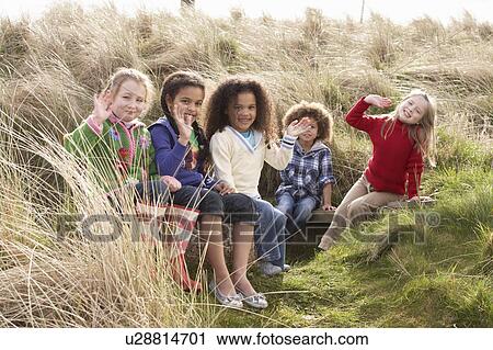 Group Of Children Playing In Field Together View Large Photo Image Stock Image - Group Of Children Playing In Field Together. Fotosearch