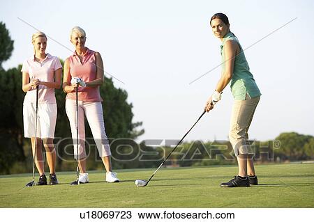 Group Of Female Golfers Teeing Off On Golf Course View Large Photo Image Stock Image - Group Of Female Golfers Teeing Off On Golf Course. Fotosearch