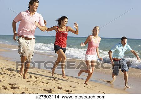 Group Of Friends Enjoying Beach Holiday View Large Photo Image Picture - Group Of Friends Enjoying Beach Holiday. Fotosearch