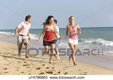 Group Of Friends Enjoying Beach Holiday View Large Photo Image Stock Image - Group Of Friends Enjoying Beach Holiday. Fotosearch