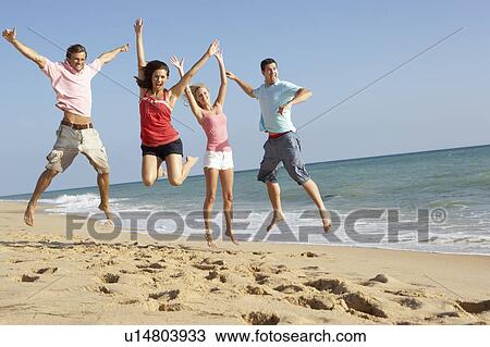 Group Of Friends Enjoying Beach Holiday View Large Photo Image Stock Image - Group Of Friends Enjoying Beach Holiday. Fotosearch