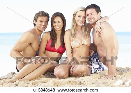 Stock Photo - Group Of Friends Enjoying Beach Holiday. Fotosearch