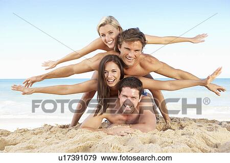 Group Of Friends Enjoying Beach Holiday View Large Photo Image Stock Photo - Group Of Friends Enjoying Beach Holiday. Fotosearch