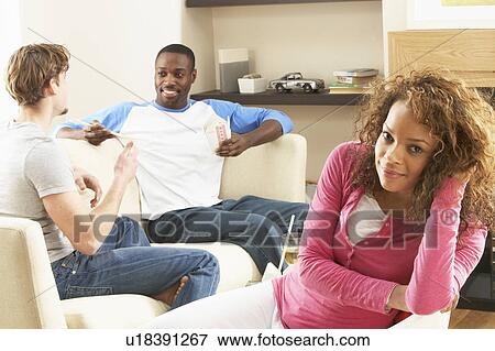 Group Of Friends Enjoying Chatting Together At Home View Large Photo Image Stock Photo - Group Of Friends Enjoying Chatting Together At Home. Fotosearch