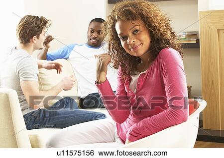 Group Of Friends Enjoying Chatting Together At Home View Large Photo Image Stock Photograph - Group Of Friends Enjoying Chatting Together At Home. Fotosearch