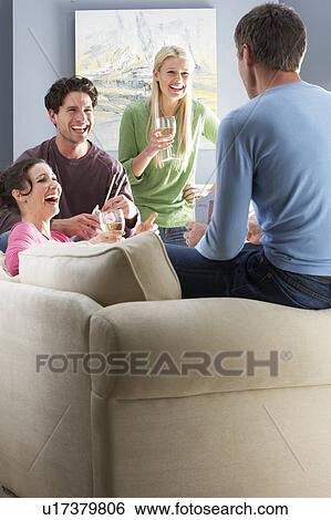Group Of Friends Enjoying Chinese Takeaway Meal At Home View Large Photo Image Stock Photograph - Group Of Friends Enjoying Chinese Takeaway Meal At Home. Fotosearch
